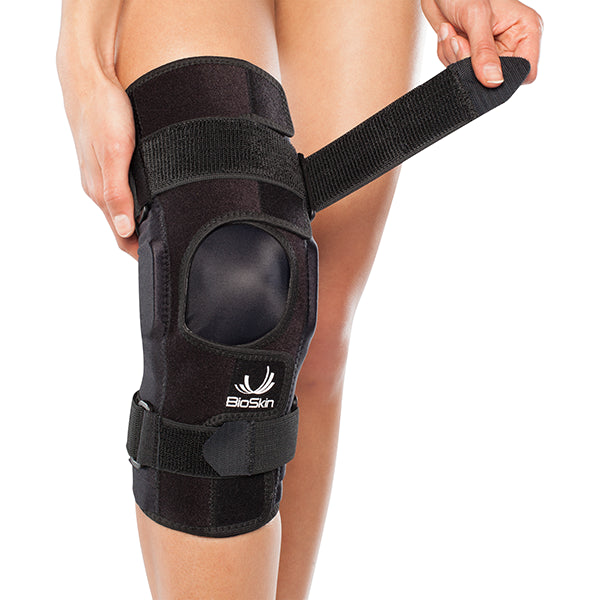 Patellofemoral Tracking Wraparound Knee Brace with Dynamic Lateral Support and Flexible Hinges.